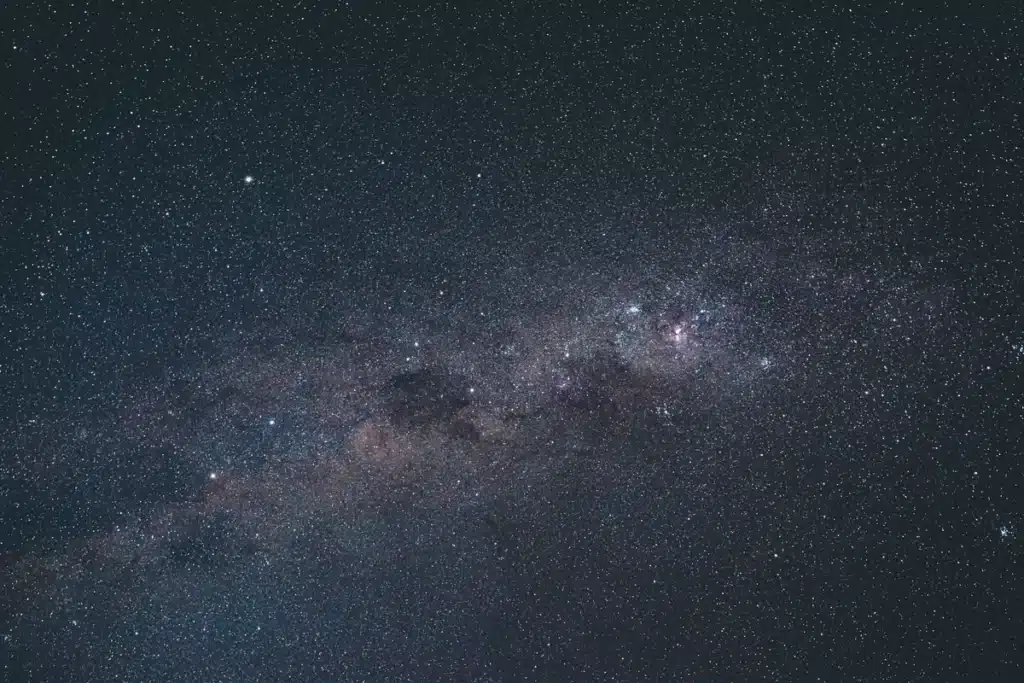 Milky Way galaxy center infrared view dark stellar clouds deep space