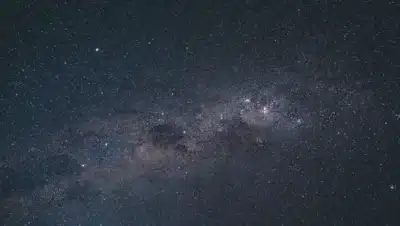 Milky Way galaxy center infrared view dark stellar clouds deep space